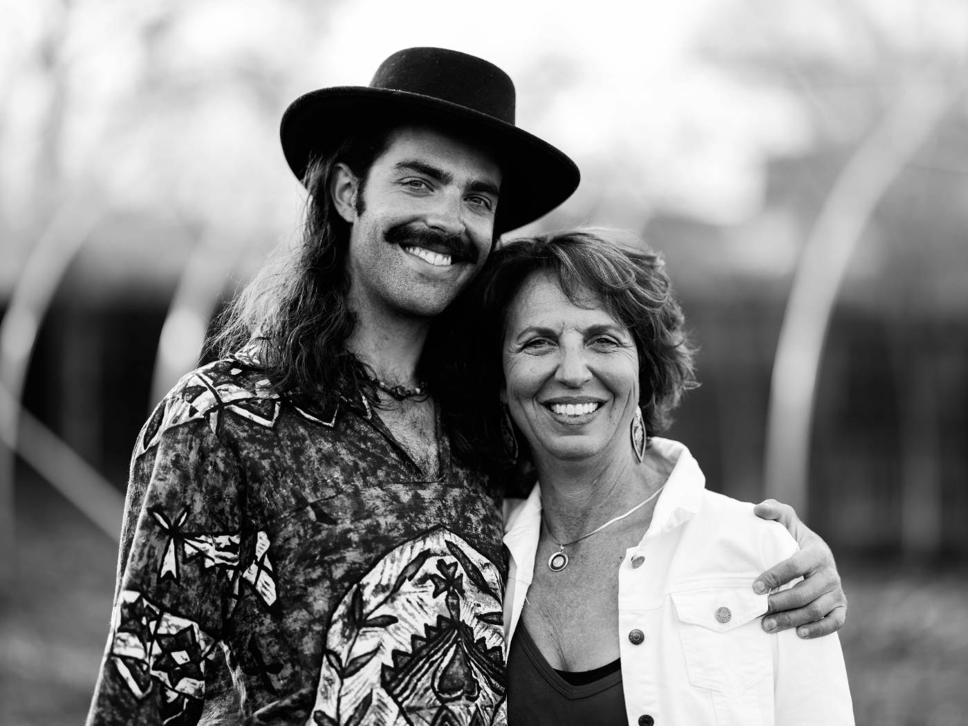 Marietta Zygaj and Scott West together outdoors, black and white portrait